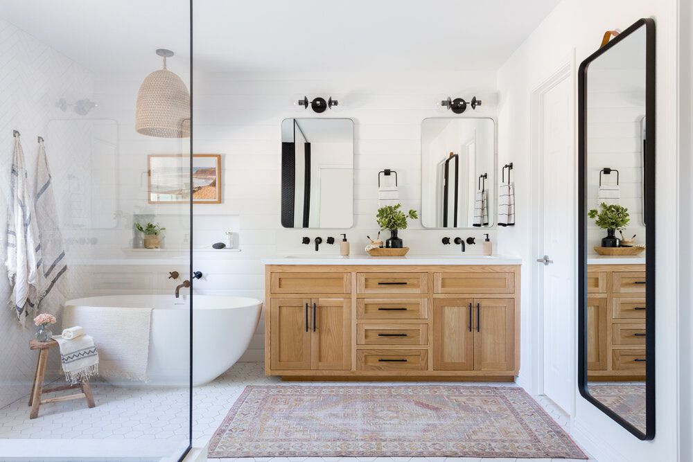 Bright bathroom with vanity and tiled walls